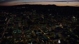 5.5K aerial stock footage flying over Downtown Portland at night in Oregon toward skyscrapers Aerial Stock Footage | AX155_302E