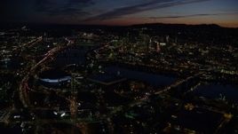 5.5K aerial stock footage approaching Moda Center, Memorial Coliseum, and Willamette River, with a view of Downtown Portland, Oregon, night Aerial Stock Footage | AX155_311E