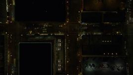 5.5K aerial stock footage of a bird's eye of following SW 4th Avenue through downtown at night, and reveal Pioneer Place Downtown Portland, Oregon Aerial Stock Footage | AX155_343E