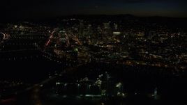 5.5K aerial stock footage of Downtown skyscrapers and bridges over the Willamette River at nighttime, Downtown Portland, Oregon Aerial Stock Footage | AX155_363E
