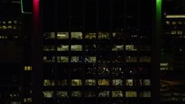 5.5K aerial stock footage tracking the top floors of Wells Fargo Center at night in Downtown Portland, Oregon Aerial Stock Footage | AX155_381E