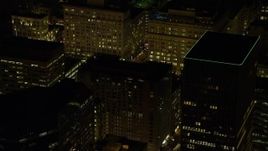 5.5K aerial stock footage flying by high-rises to reveal SW 5th Avenue at night in Downtown Portland, Oregon Aerial Stock Footage | AX155_390