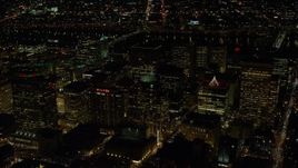 5.5K aerial stock footage of high-rises and skyscrapers by the Willamette River at night in Downtown Portland, Oregon Aerial Stock Footage | AX155_391E