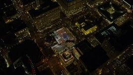 5.5K aerial stock footage flying over skyscrapers to reveal Christmas tree in Pioneer Courthouse Square at night in Downtown Portland, Oregon Aerial Stock Footage | AX155_403E