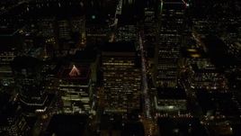 5.5K aerial stock footage flying over downtown and by PacWest Center, SW Jefferson Street, and Wells Fargo Center at night in Downtown Portland, Oregon Aerial Stock Footage | AX155_412E