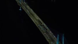 5.5K aerial stock footage tracking and a reverse view of a commuter train crossing the Tilikum Crossing bridge at night in South Portland, Oregon Aerial Stock Footage | AX155_418