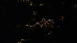 5.5K aerial stock footage approaching a suburban home at night decorated for Christmas, Southwest Portland, Oregon Aerial Stock Footage | AX155_442