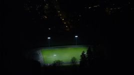 5.5K aerial stock footage approaching and flying over high school soccer field at night, Southwest Portland, Oregon Aerial Stock Footage | AX155_443