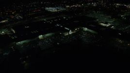 5.5K aerial stock footage orbiting the side of Washington Square shopping mall at night in Tigard, Oregon Aerial Stock Footage | AX155_454E