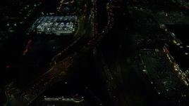 5.5K aerial stock footage of and tilt to the interchange of Highways 210 and 217 at night, Beaverton, Oregon Aerial Stock Footage | AX155_460