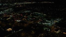 5.5K aerial stock footage flying over warehouse buildings, approach Highway 217 and Beaverton Town Square at night, Beaverton, Oregon Aerial Stock Footage | AX155_464E