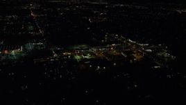 5.5K aerial stock footage approaching and tilt to stores on SW Cedar Hills Boulevard at night, Beaverton, Oregon Aerial Stock Footage | AX155_467