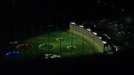 5.5K aerial stock footage passing a warehouse building and a Topgolf course in Hillsboro, Oregon at night Aerial Stock Footage | AX155_475E