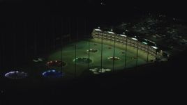 5.5K aerial stock footage slowly flying by a Topgolf course in Hillsboro, Oregon at night Aerial Stock Footage | AX155_476
