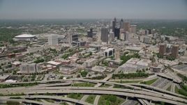 4.8K aerial stock footage flying over freeways toward Downtown Atlanta skyscrapers, Georgia Aerial Stock Footage | AX36_002E