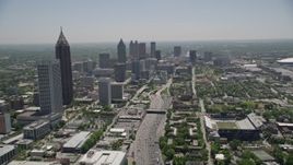 4.8K aerial stock footage tilting up from Downtown Connector to reveal skyscrapers, Downtown Atlanta Aerial Stock Footage | AX36_018E