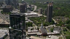 4.8K aerial stock footage orbiting 3630 Peachtree Road, revealing a baptist church and shopping center, Buckhead, Georgia Aerial Stock Footage | AX36_072