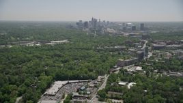 4.8K aerial stock footage tilting up from Peachtree Road to reveal Midtown Atlanta skyscrapers, Georgia Aerial Stock Footage | AX36_081