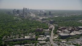 4.8K aerial stock footage following Peachtree Road toward Midtown Atlanta skyline; Buckhead, Georgia Aerial Stock Footage | AX36_082E