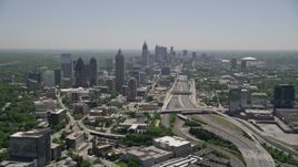4.8K aerial stock footage following Downtown Connector toward Midtown Atlanta skyscrapers, Georgia Aerial Stock Footage | AX36_085E