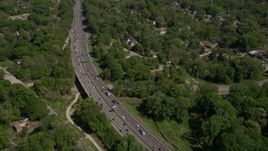 4.8K aerial stock footage of light traffic on a freeway tilt up revealing residential area, West Atlanta Aerial Stock Footage | AX37_007