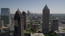 4.8K aerial stock footage of flying by Midtown Atlanta skyscrapers to reveal the freeway, Georgia Aerial Stock Footage | AX37_040E