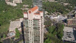 4.8K aerial stock footage of a medium shot of Park Avenue Condos revealing skyscrapers, Buckhead, Georgia Aerial Stock Footage | AX38_024