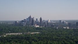 4.8K aerial stock footage of Midtown Atlanta skyscrapers  beyond trees, Buckhead, Georgia Aerial Stock Footage | AX38_028