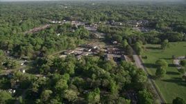 4.8K aerial stock footage flying by abandoned buildings among trees, West Atlanta Aerial Stock Footage | AX38_082