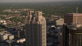 4.8K aerial stock footage flying by Westin Peachtree Plaza Hotel and 191 Peachtree Tower, Downtown Atlanta Aerial Stock Footage | AX39_005