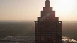 4.8K aerial stock footage orbiting top of SunTrust Plaza, Downtown Atlanta, sunset Aerial Stock Footage | AX39_038