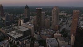 4.8K aerial stock footage flying over Downtown toward Westin Peachtree Plaza Hotel, Atlanta, Georgia, twilight Aerial Stock Footage | AX40_004E