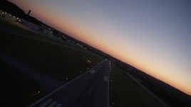 4.8K aerial stock footage flying over the runway at Fulton County Airport, Georgia, sunset Aerial Stock Footage | AX40_018