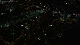 4.8K aerial stock footage tilting to heavy traffic on the expressway, Buckhead, Georgia, night Aerial Stock Footage | AX41_036E
