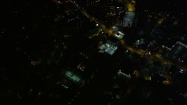 4.8K aerial stock footage following a road through the city, Buckhead, Georgia, night Aerial Stock Footage | AX41_053