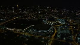 4.8K aerial stock footage flying away from Georgia Dome revealing downtown skyline, Atlanta, night Aerial Stock Footage | AX41_064