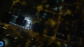 4.8K aerial stock footage approaching SunTrust Plaza and tilt down to bird's eye of city streets, Downtown Atlanta, night Aerial Stock Footage | AX41_067
