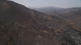 5K aerial stock footage pan across scorched slopes of Santa Monica Mountains, California, and fly over them Aerial Stock Footage | AX42_003E