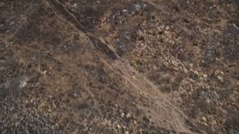 5K aerial stock footage fly over charred slopes to reveal rural homes destroyed by wildfires, Santa Monica Mountains, California Aerial Stock Footage | AX42_017