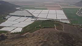 5K aerial stock footage flyby orchard, crop fields and greenhouses, Camarillo, California Aerial Stock Footage | AX42_019E