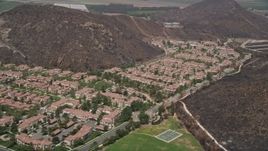 5K aerial stock footage approach condominiums and duplex homes at the base of hills, Camarillo, California Aerial Stock Footage | AX42_021