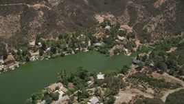 5K aerial stock footage fly over Malibu Lake and tilt to lakefront homes on the shore, Agoura Hills, California Aerial Stock Footage | AX42_114