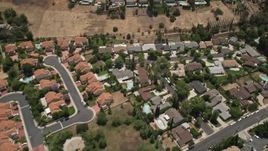5K aerial stock footage reverse view of tract homes with swimming pools in Calabasas, California Aerial Stock Footage | AX42_118