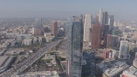 4K aerial stock footage flying by Ritz-Carlton toward I-110 and Downtown skyscrapers, Los Angeles, California Aerial Stock Footage | AX43_022
