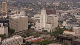4K aerial stock footage flying by Bank of America Center to reveal Los Angeles City Hall, Downtown Los Angeles, California Aerial Stock Footage | AX43_024