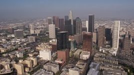 4K aerial stock footage flying by Downtown Los Angeles skyscrapers seen from north of the city, California Aerial Stock Footage | AX43_030E