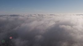 4K aerial stock footage flying over a marine layer covering Los Angeles, California Aerial Stock Footage | AX43_046