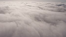 4K aerial stock footage flying by a dense, sunlit marine layer, Los Angeles, California Aerial Stock Footage | AX43_051