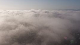 4K aerial stock footage panning across marine layer clouds over Los Angeles, California Aerial Stock Footage | AX43_057