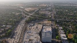 4K aerial stock footage flying over office buildings and the Sherman Oaks Galleria to approach heavy traffic on the I-405 and 101 interchange, Sherman Oaks, California Aerial Stock Footage | AX43_063E